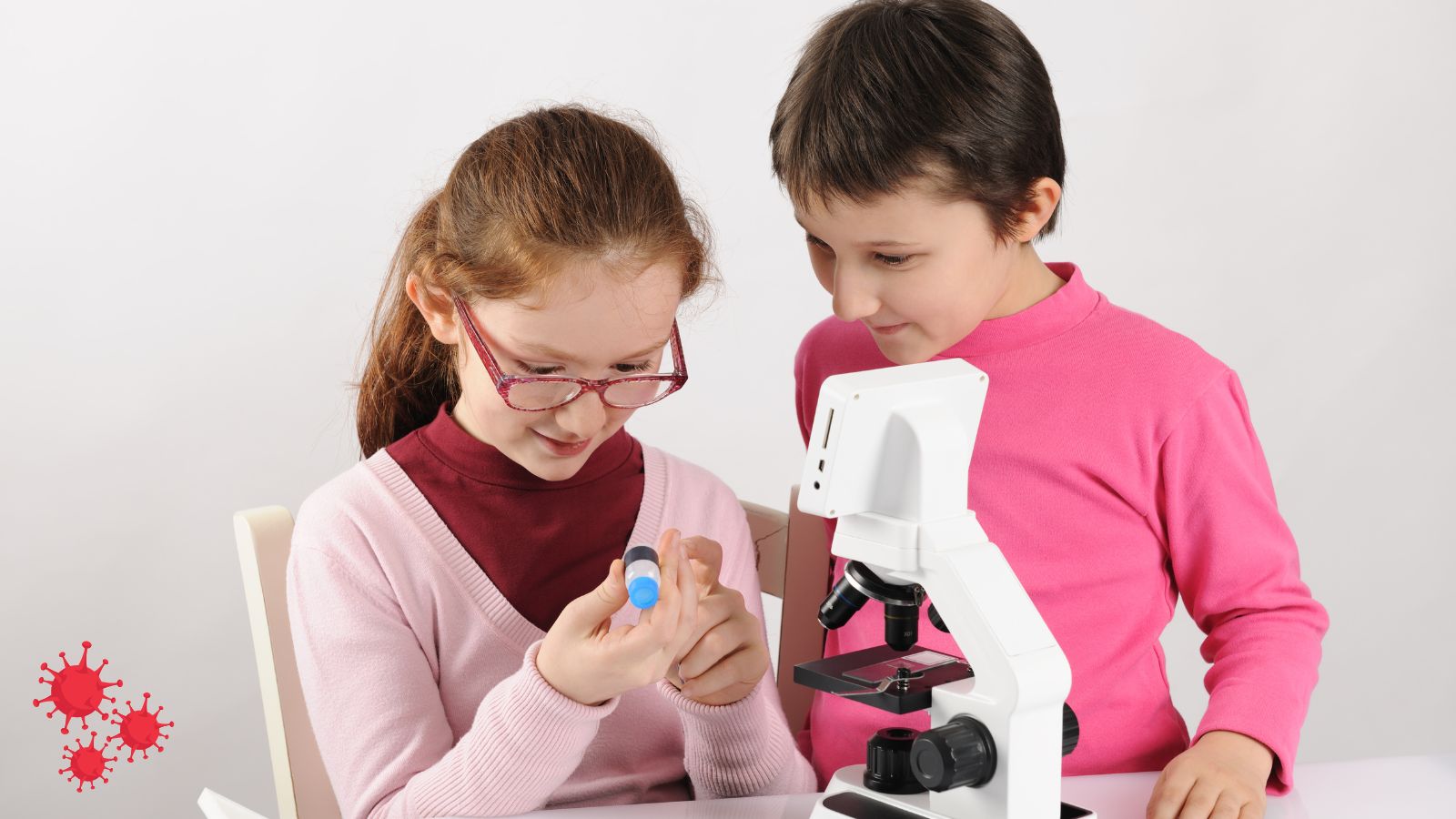 kids checking out a microscope.